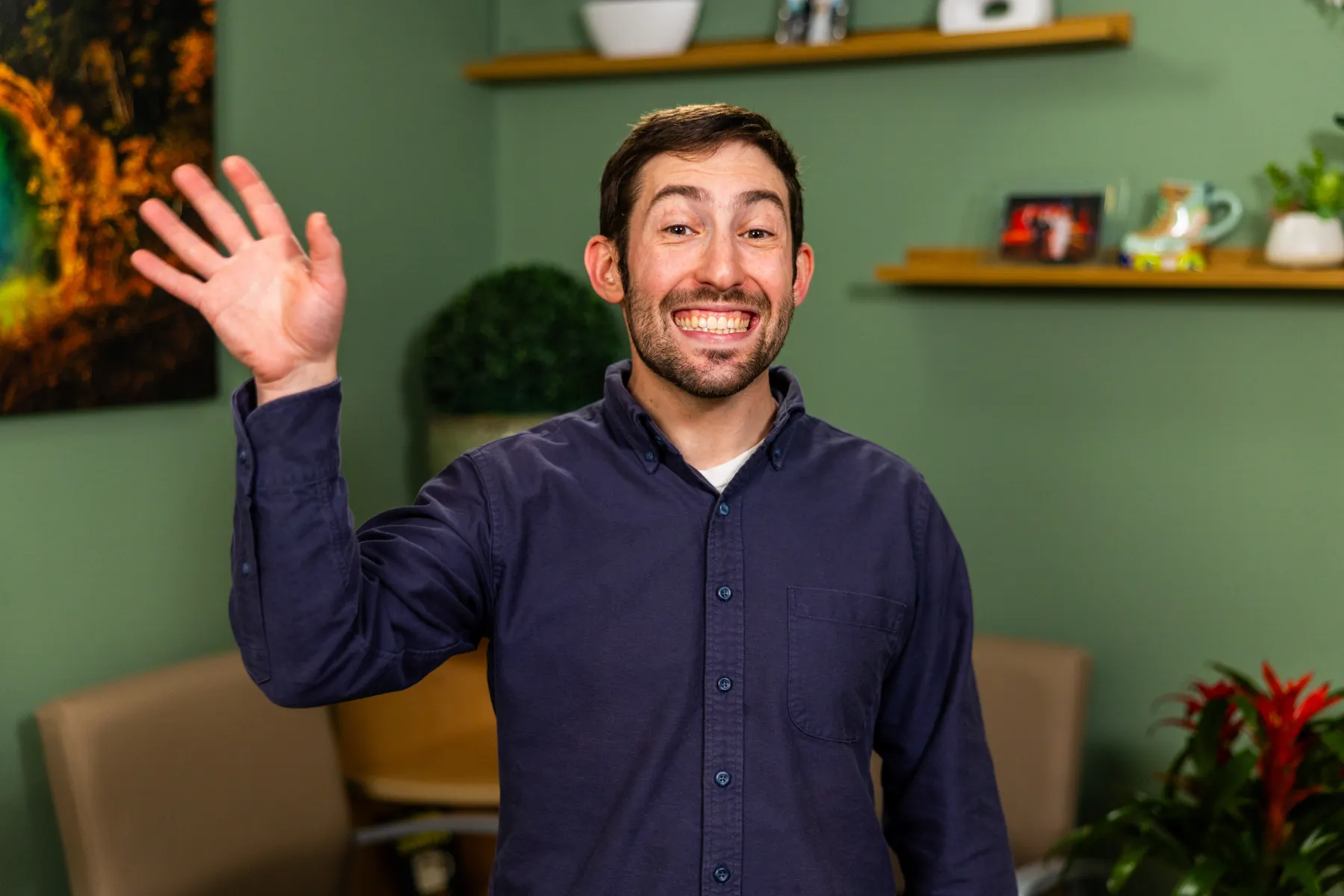 Dr. Mitchell Sable waving in the Smile Brightly office
