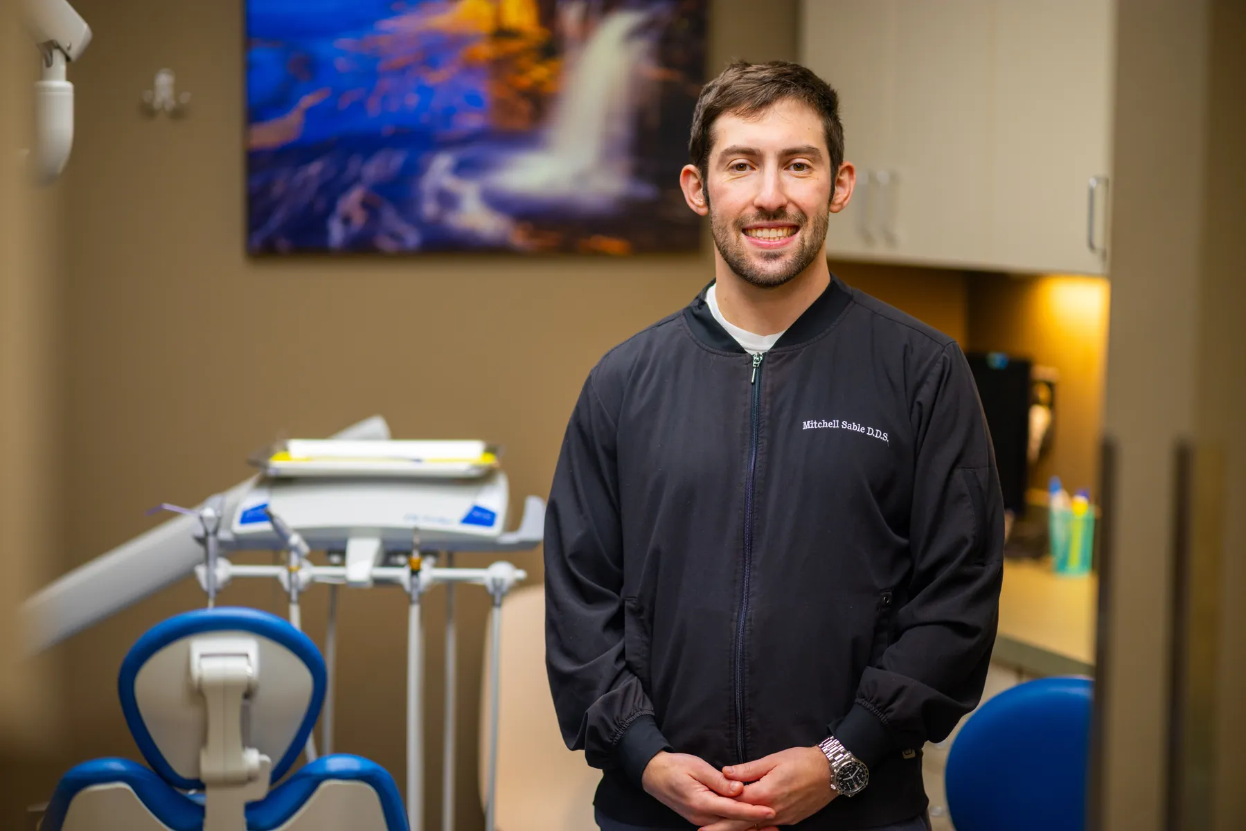 Dr. Mitchell Sable standing in a Smile Brightly treatment room
