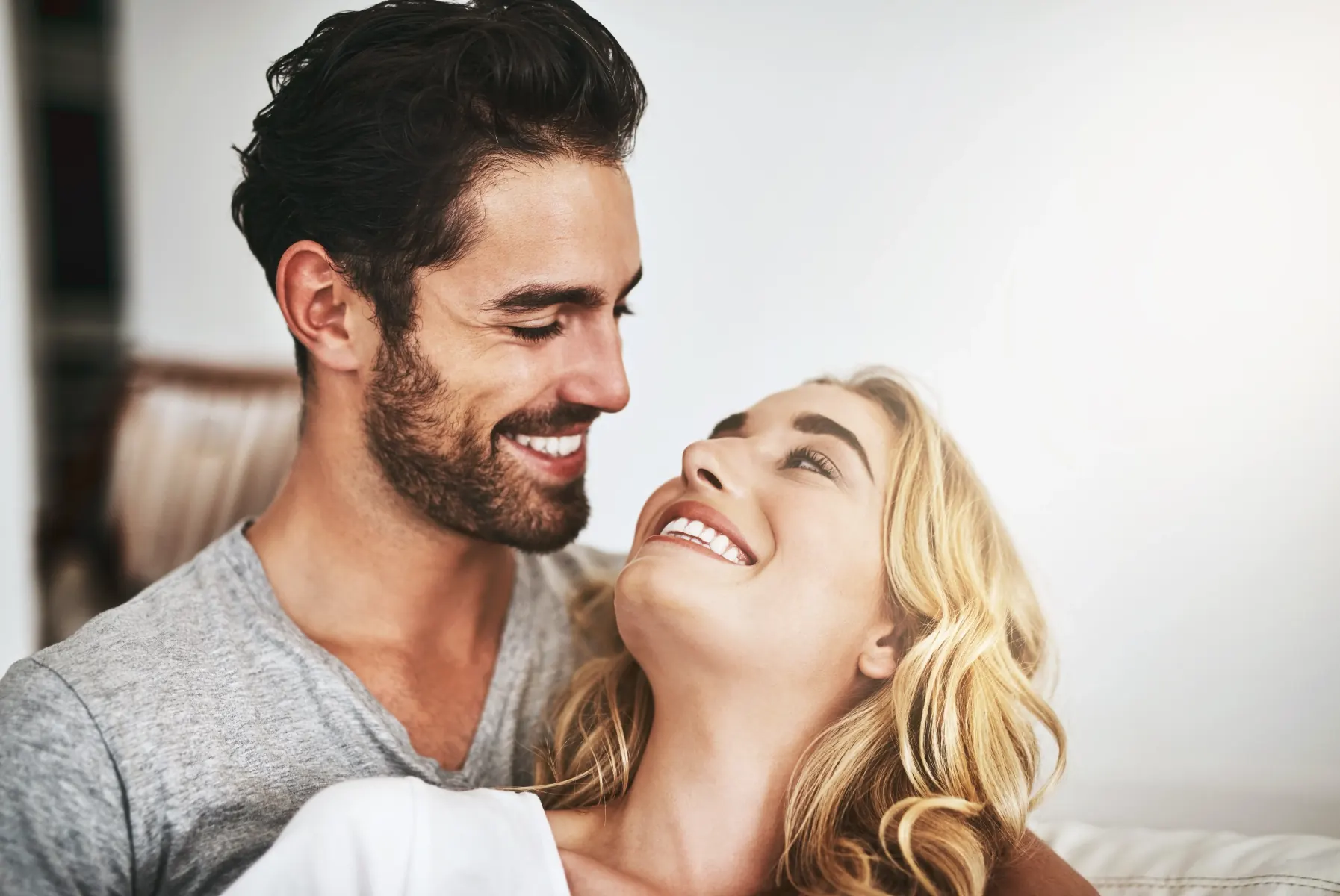 A smiling couple after cosmetic dental care